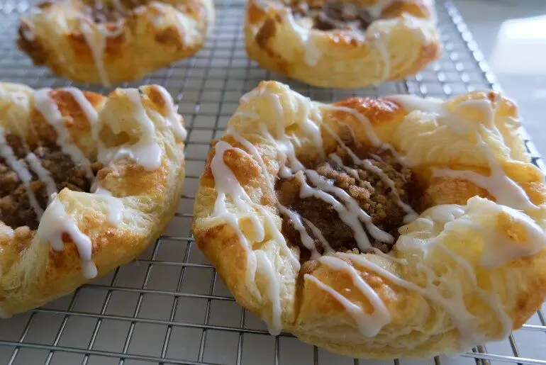 four danishes arranged on a cooling rack