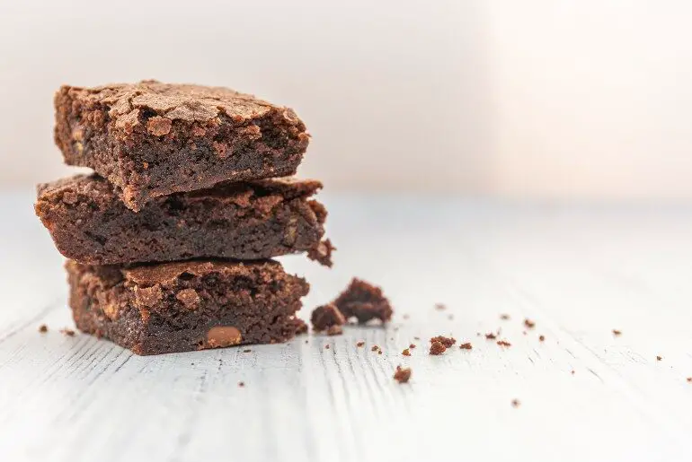 3 brownies stacked with a white background