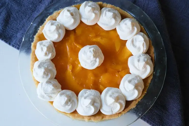 peach pie on a blue cloth
